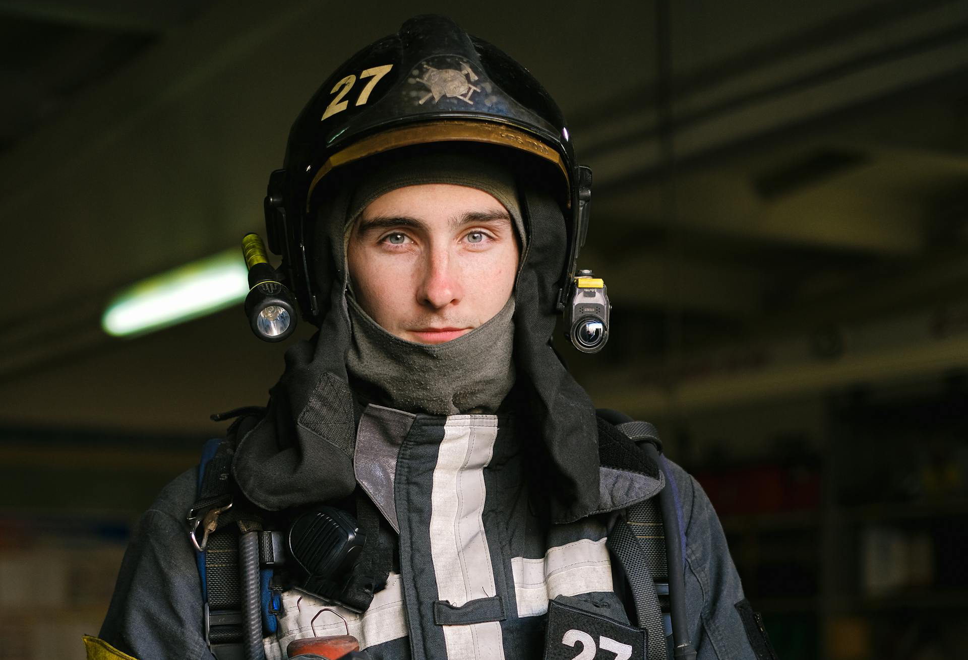 Portrait of Firefighter with Mask in Hand