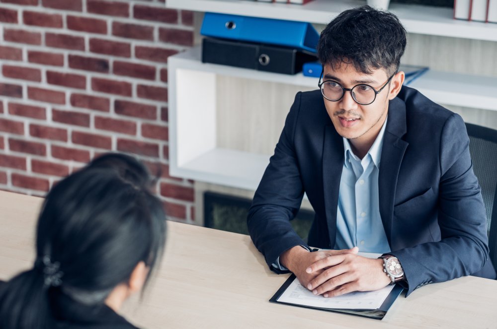 Portrait Photo of a man during a job interview in office