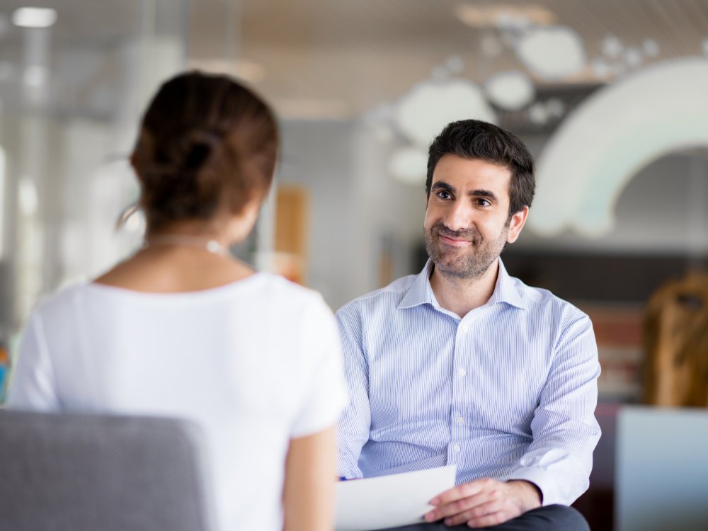 Portrait Photo of a man during a job interview in office