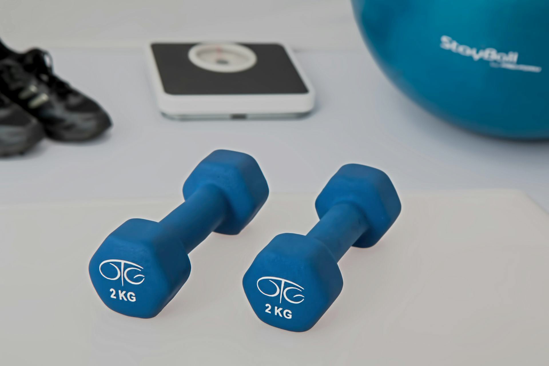 Dumbbells with exercise equipment in background