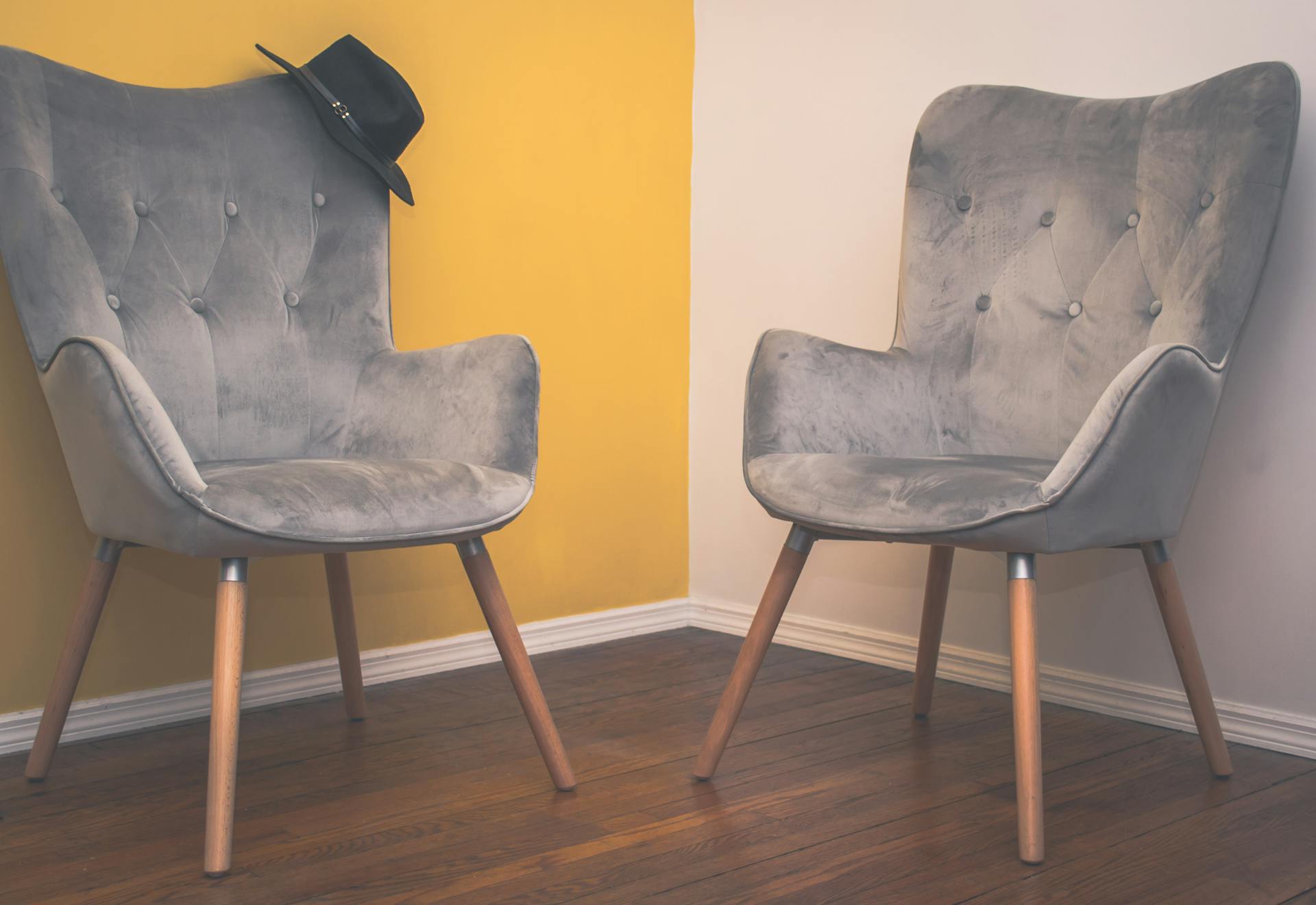 Two Suede Armchairs in A Room