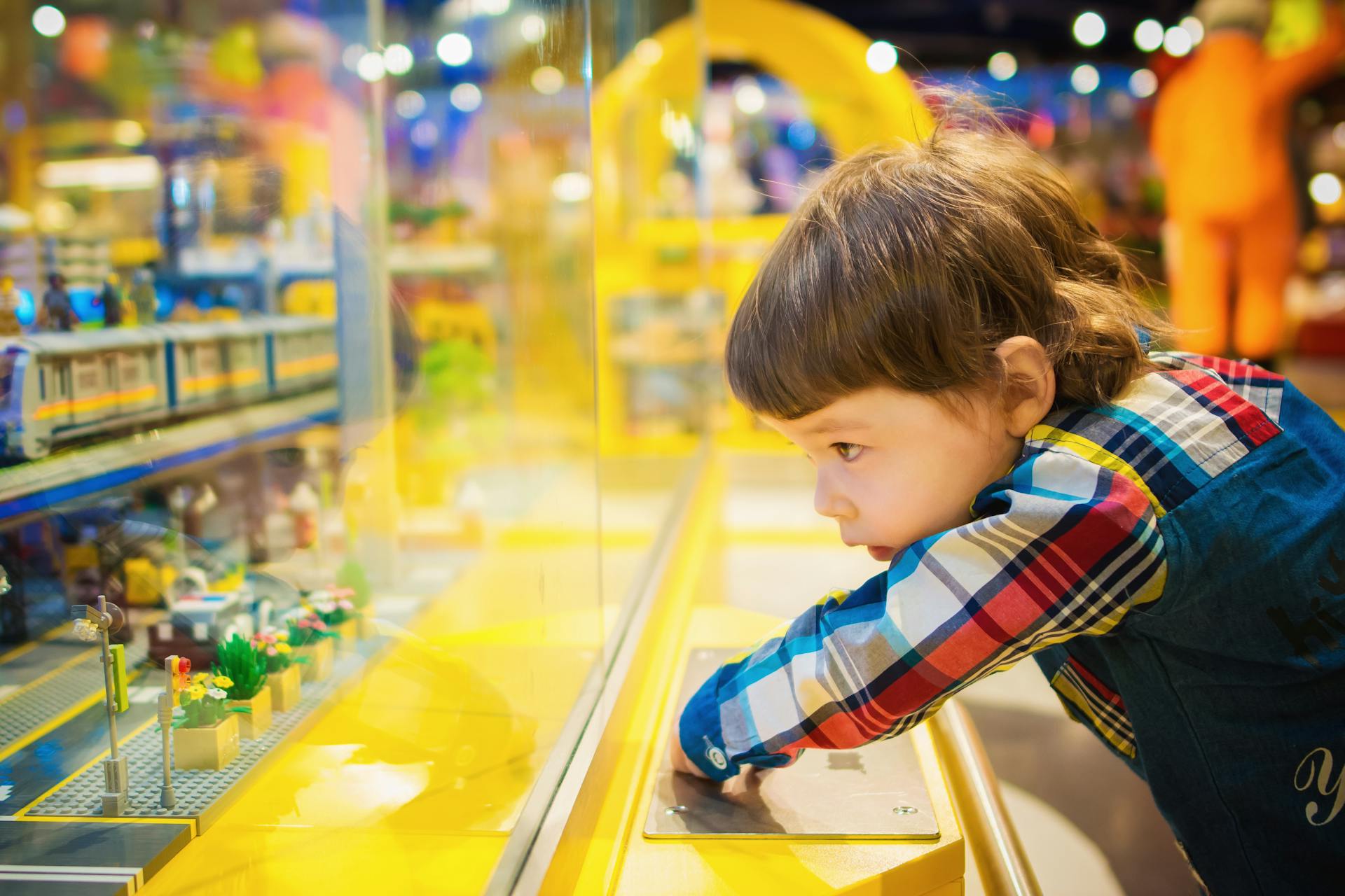 Selective Focus Photography of Toddler in A Store