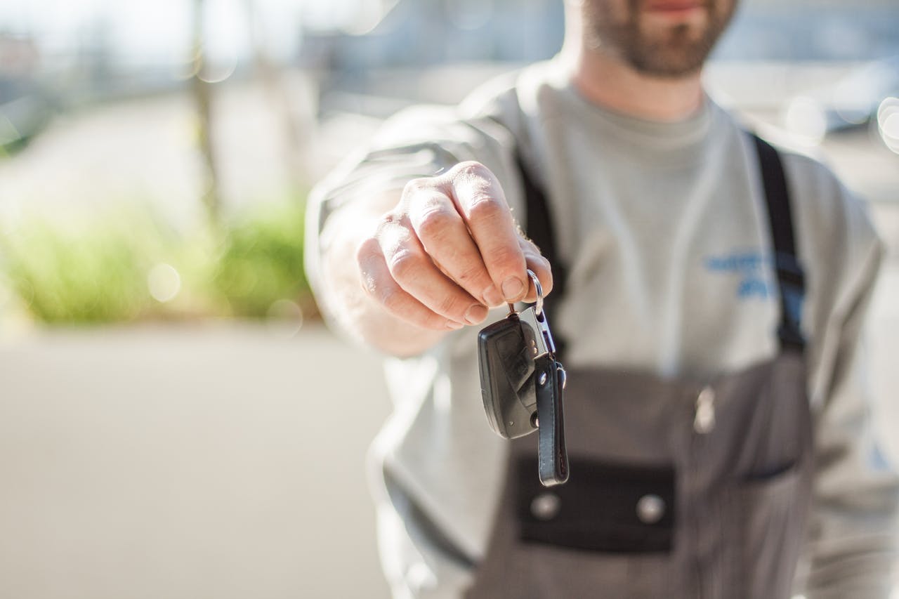 Car Key held by a Man