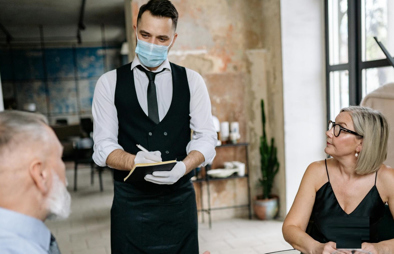 Man is Taking Order at the Restaurant