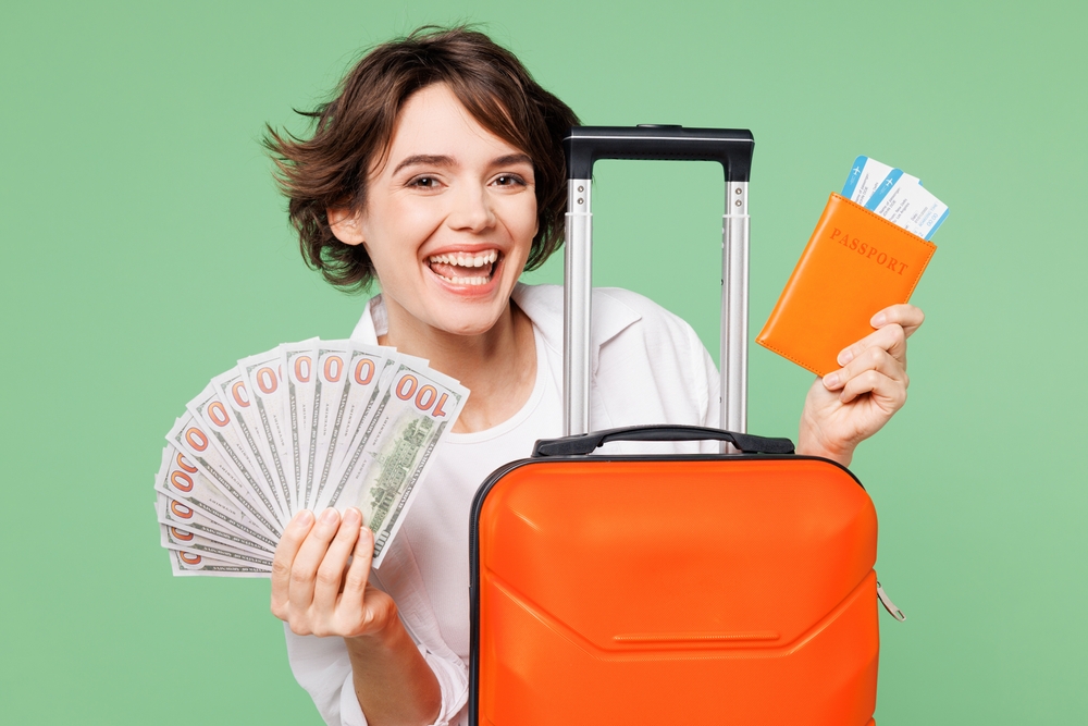 Woman wear casual clothes hold passport ticket suitcase bag fan cash money