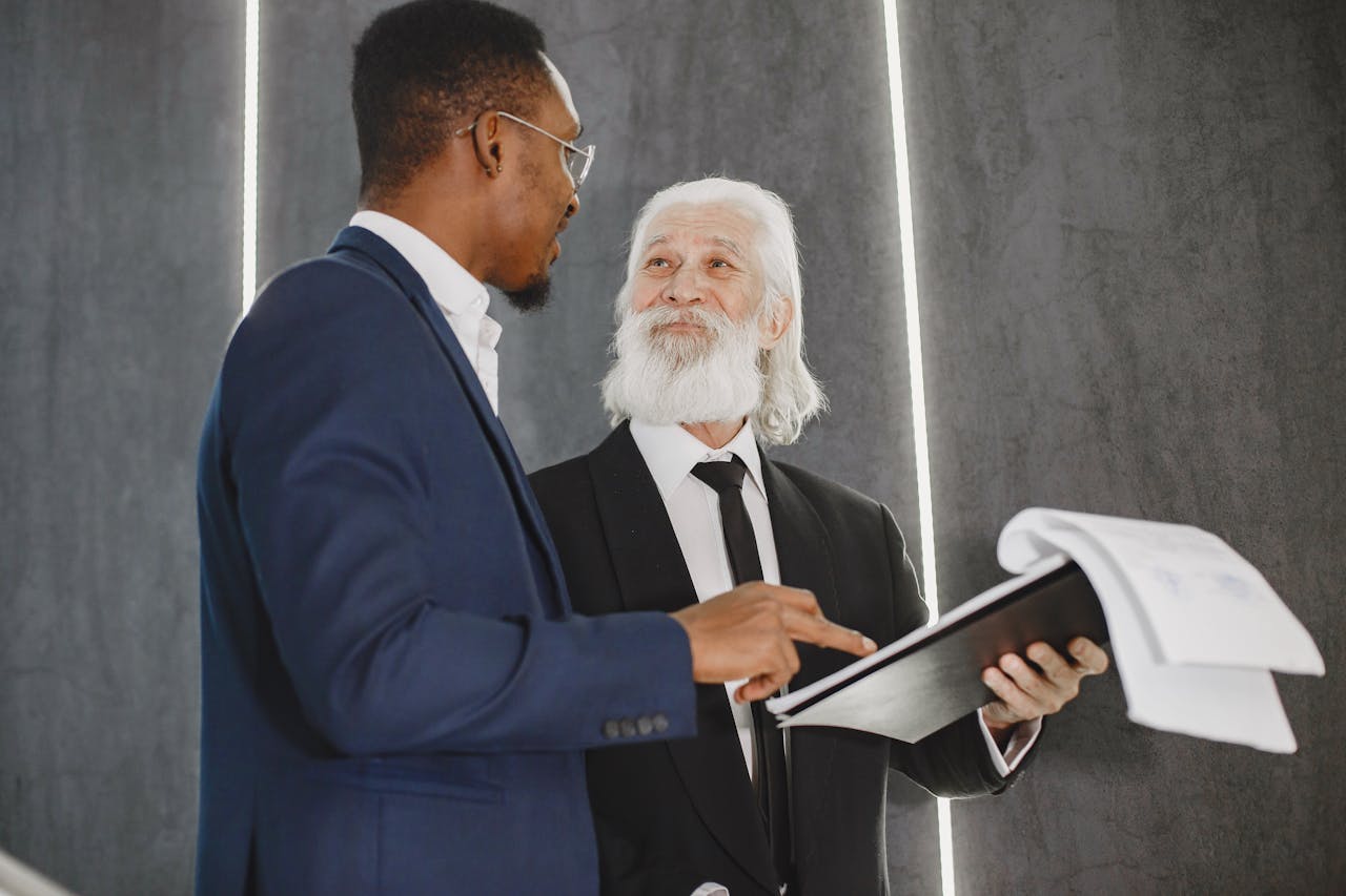 Two Men in Suits Discussing