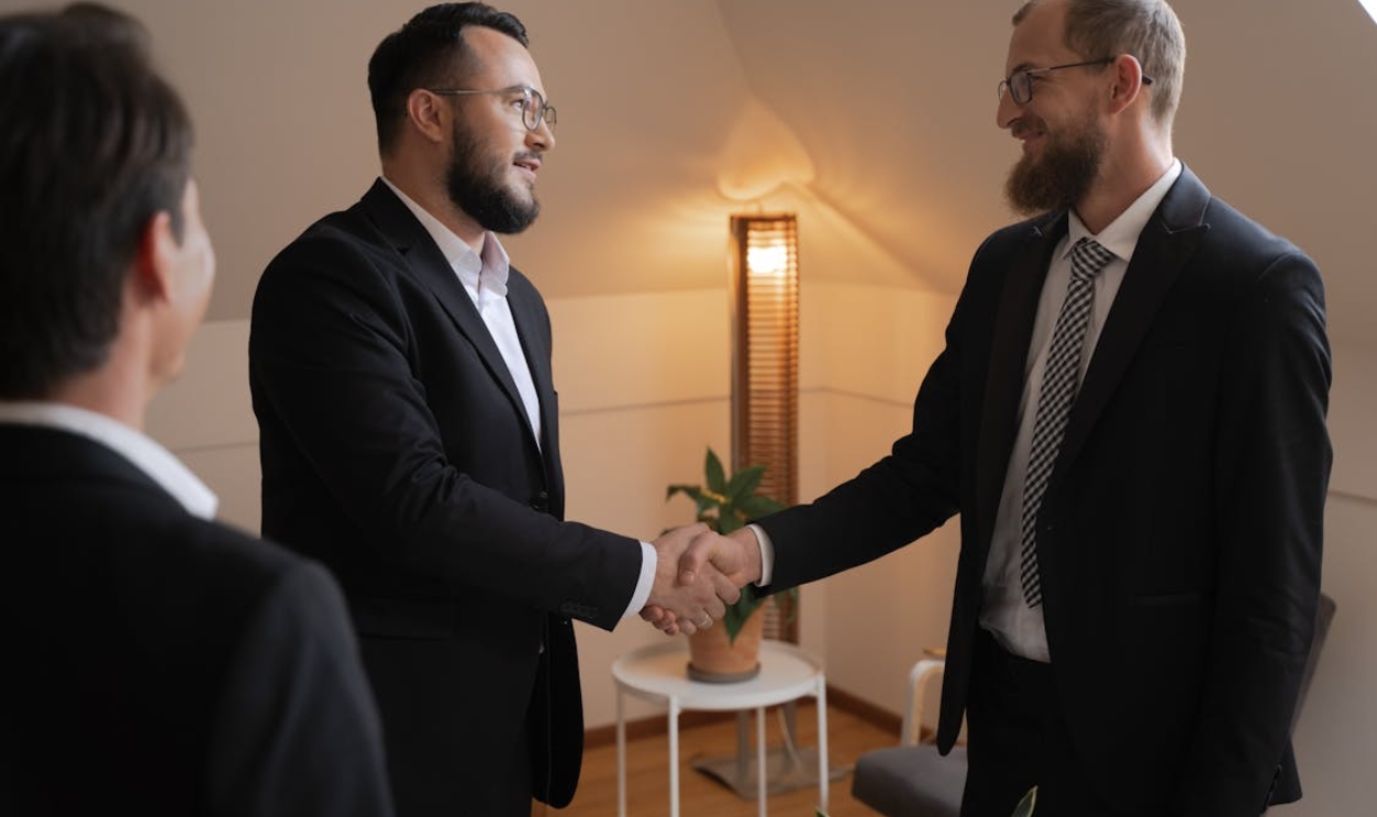 two-men-in-business-attire-handshaking