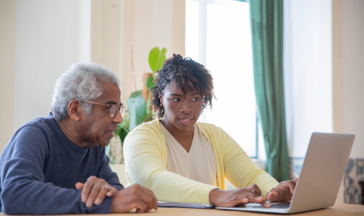 a-man-and-a-woman-using-a-laptop-together