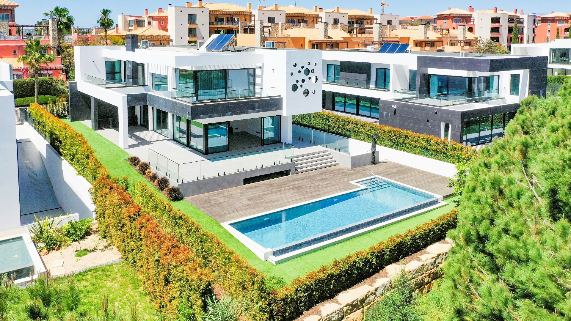 an aerial view of a house with a swimming pool