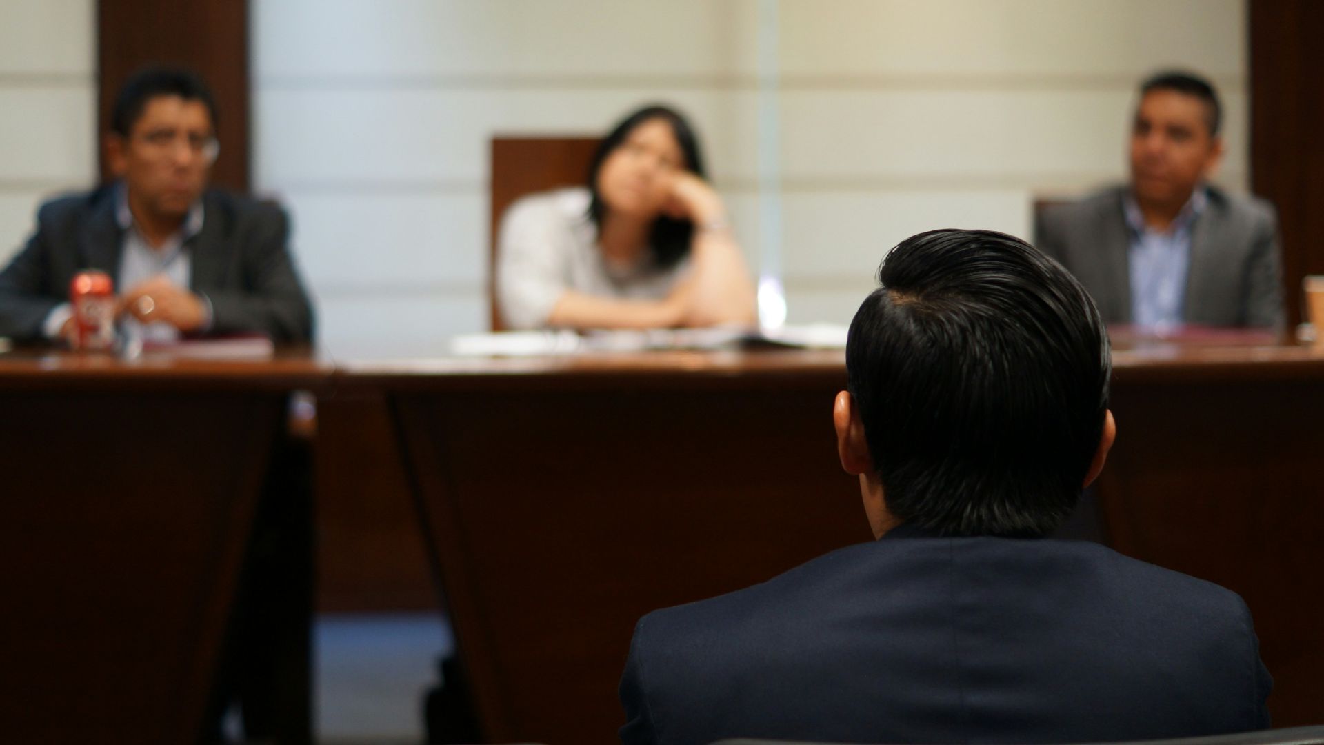 man in black shirt sitting beside woman in white shirt