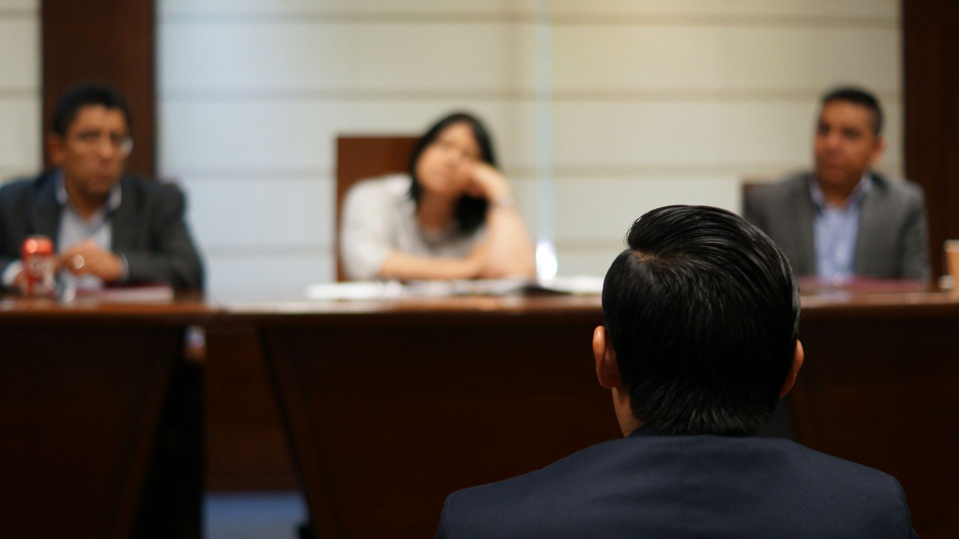 man in black shirt sitting beside woman in white shirt