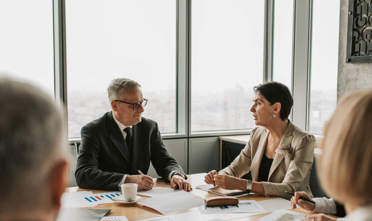 Man and woman discussing business
