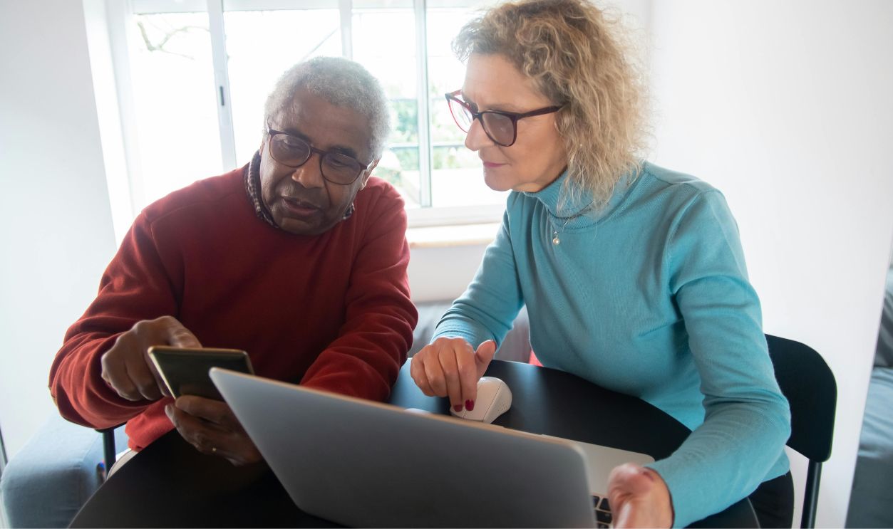 Man and woman using gadgets