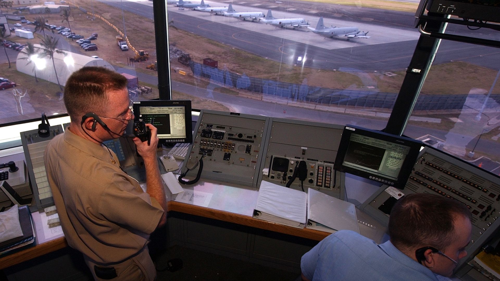 File:US Navy 040707-N-6932B-066 Air Traffic Controller Chief John Gay and Air Traffic Controller 2nd Class Wesley Washabaugh correspond with ground support in preparation for inbound aircraft.jpg