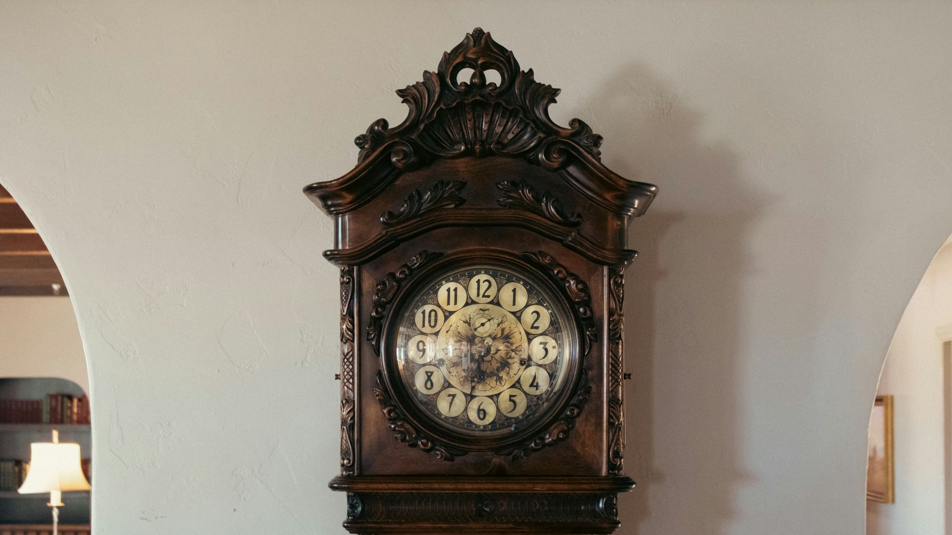 A grandfather clock sitting on top of a table