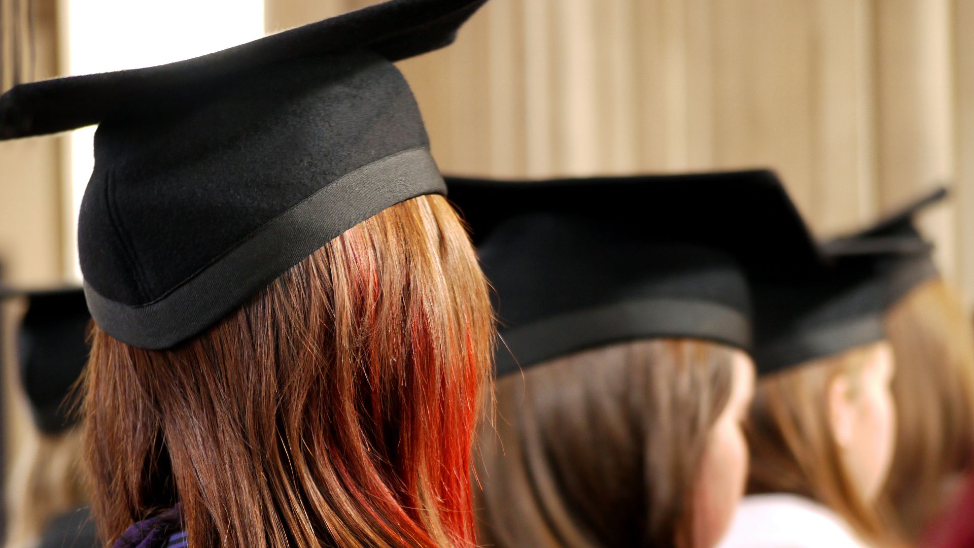 women on square academic caps