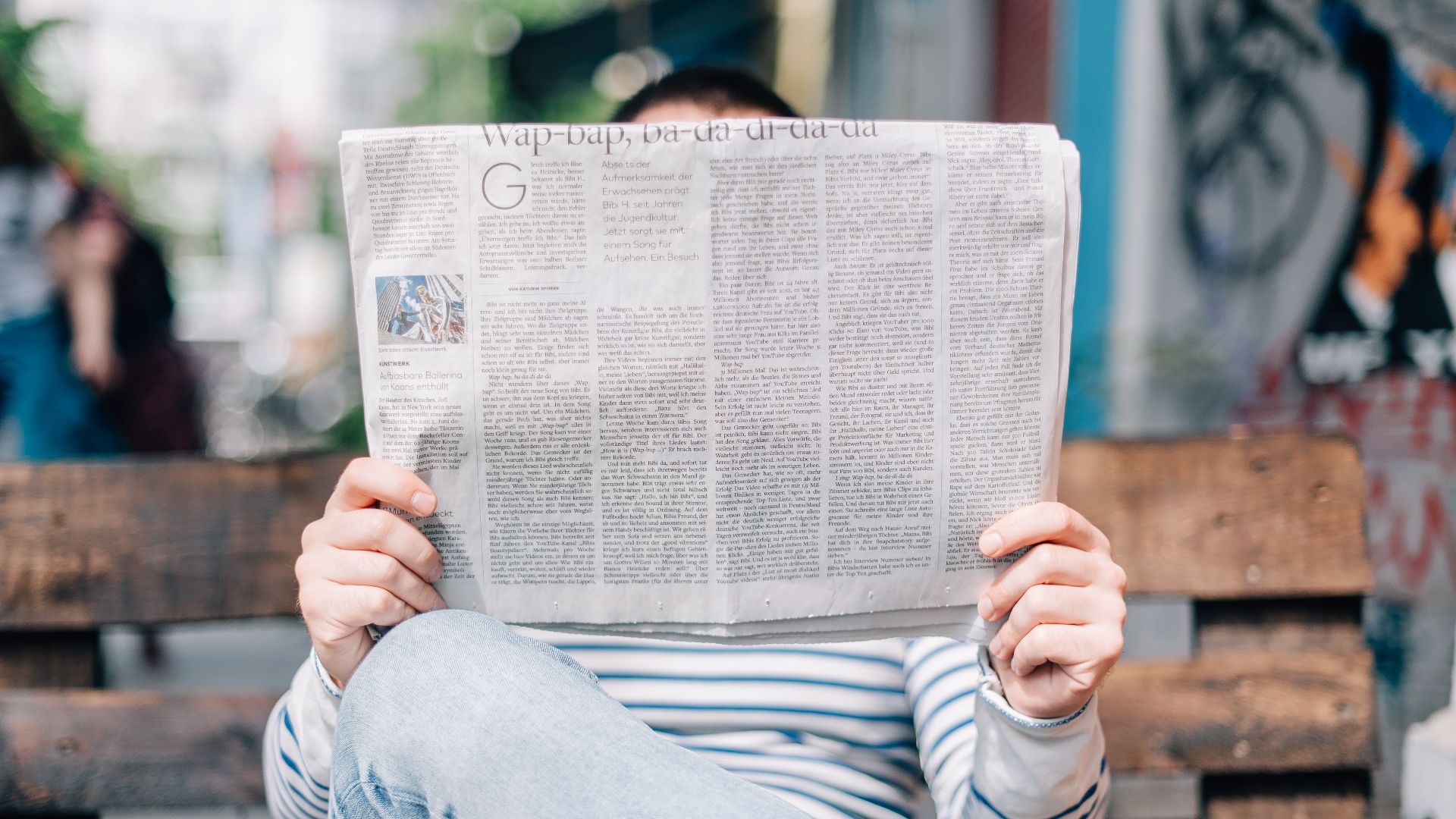 File:Person reading a newspaper (Unsplash).jpg