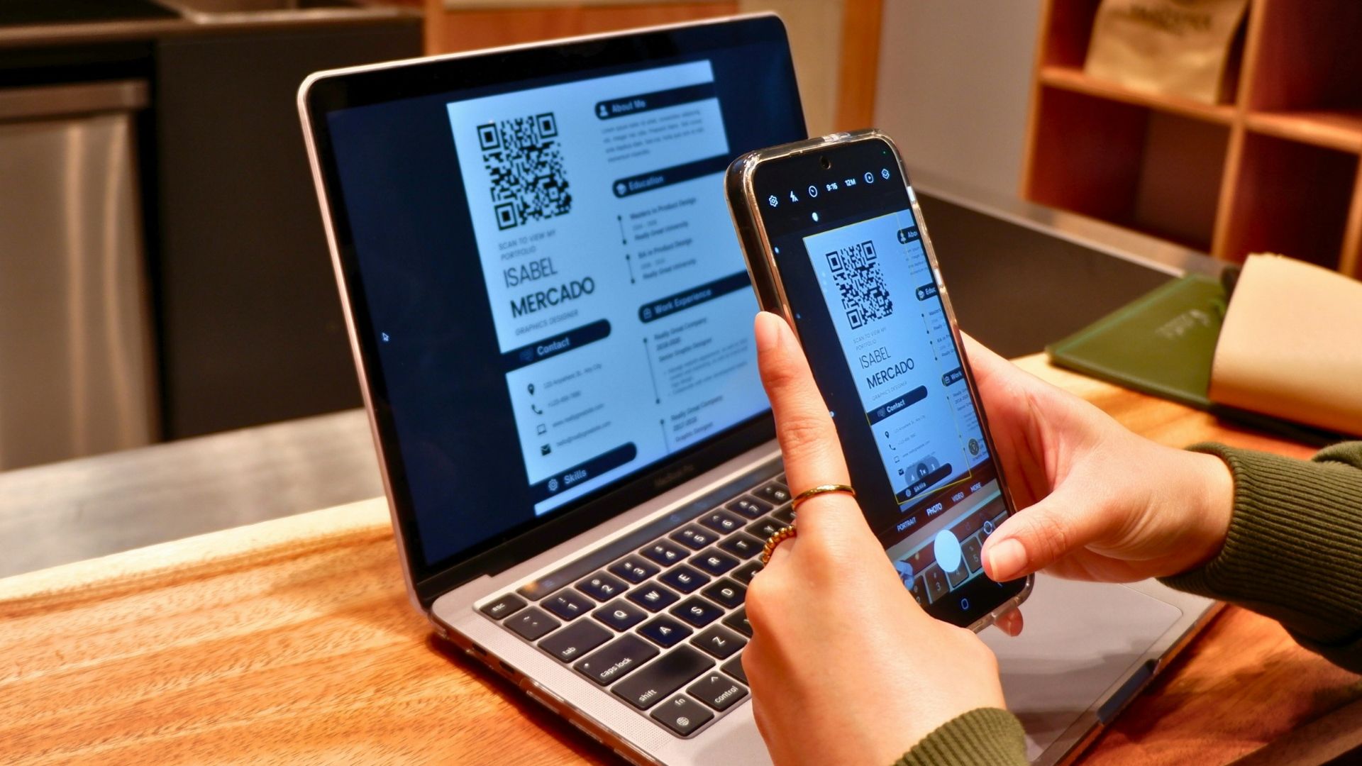 a person using a laptop and a cell phone