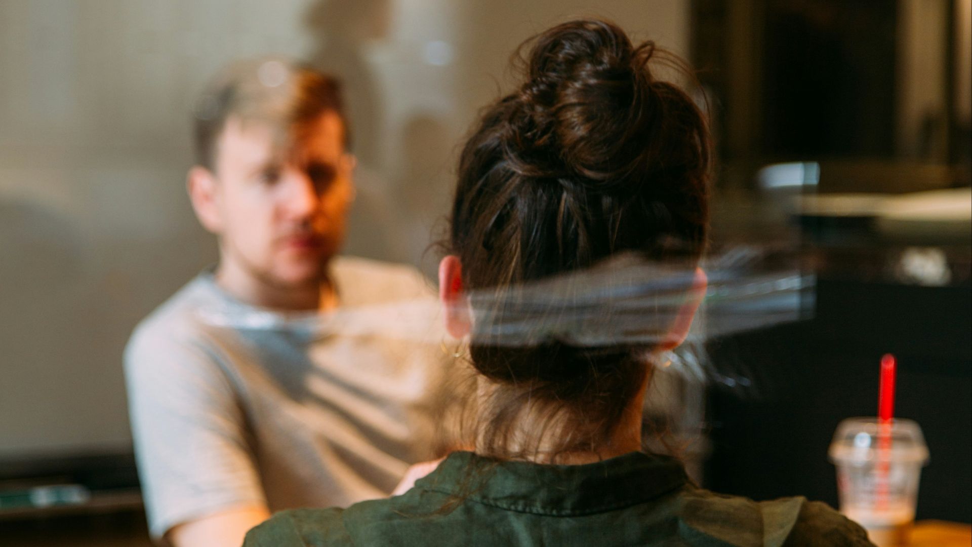 person sitting in a chair in front of a man
