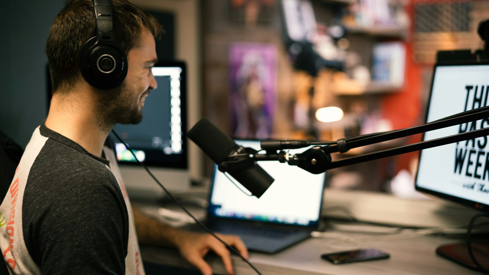 man in gray collared shirt wearing black headphones