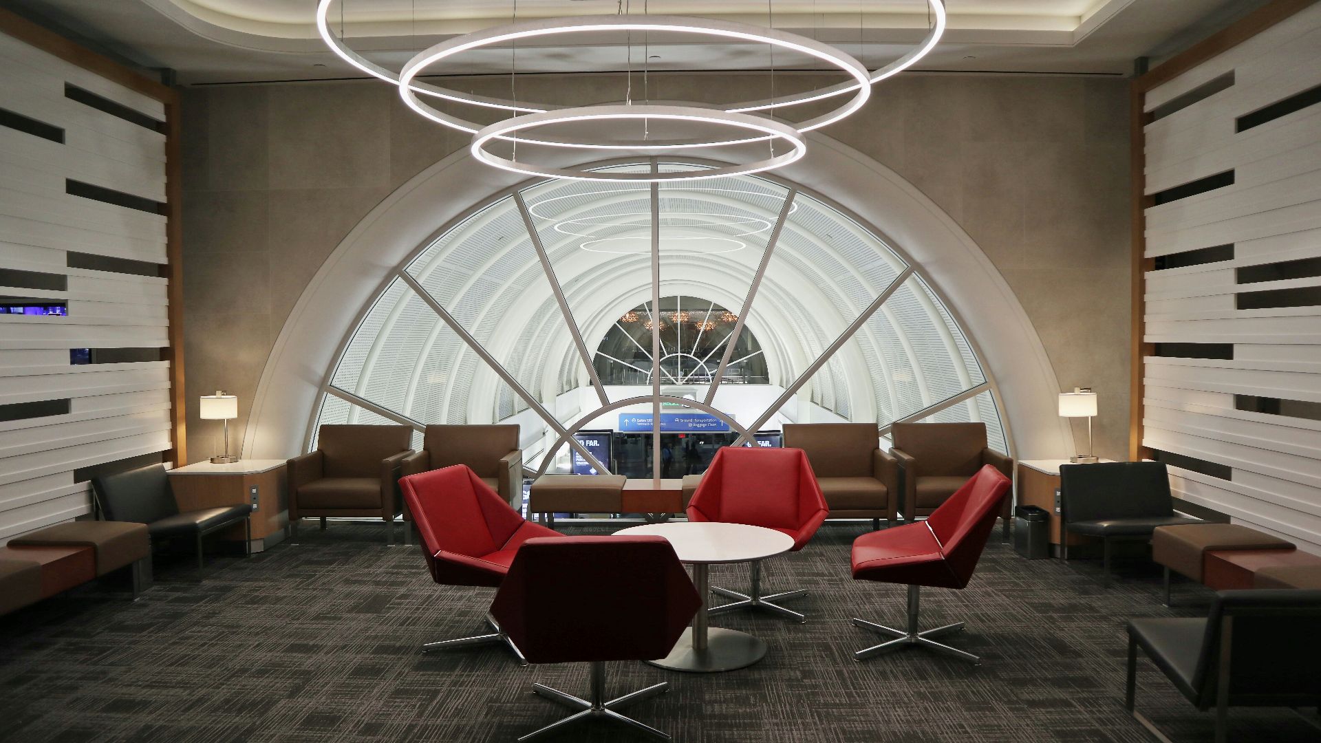 a room with a lot of chairs and tables