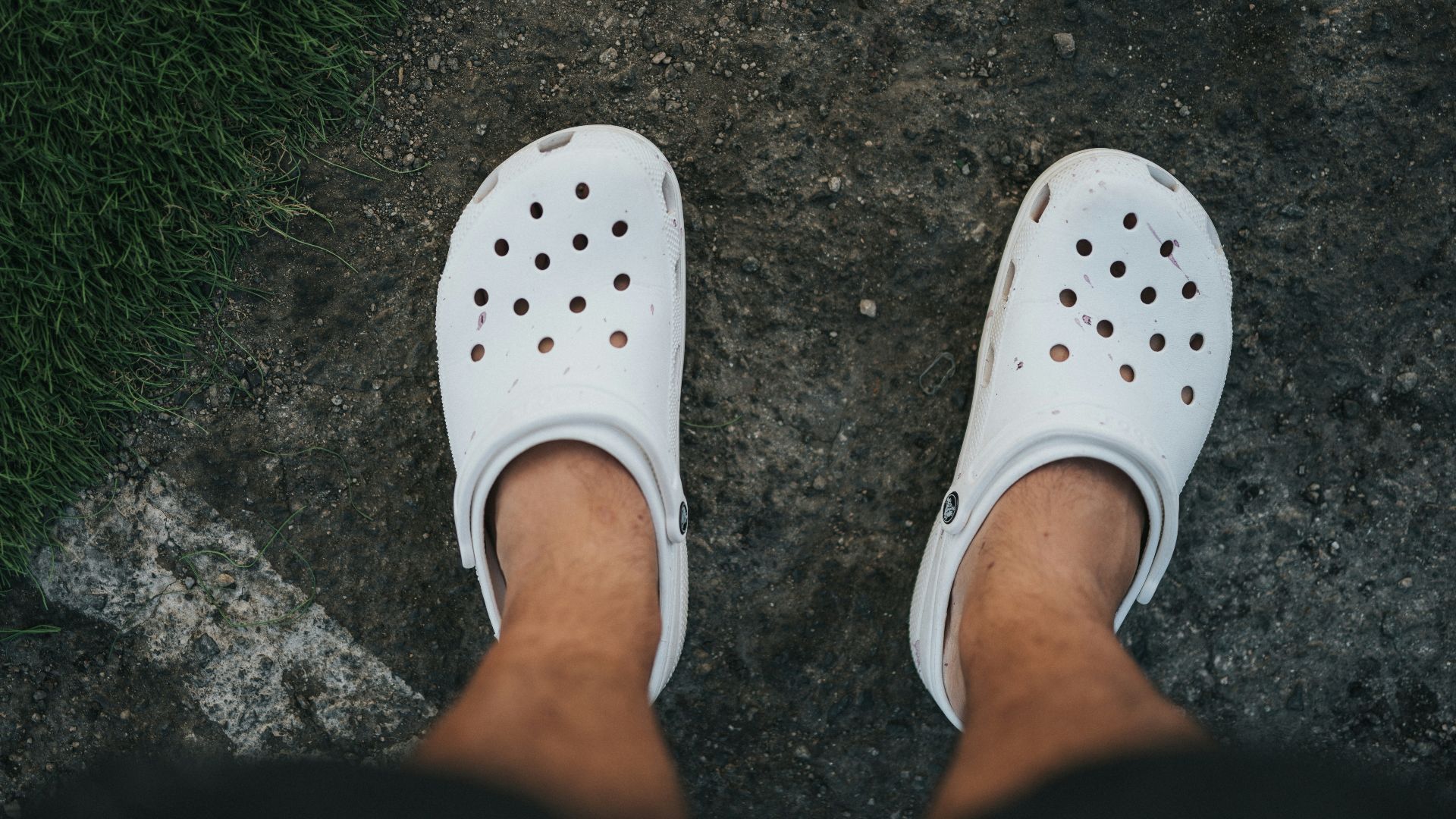 person wearing white rubber clog