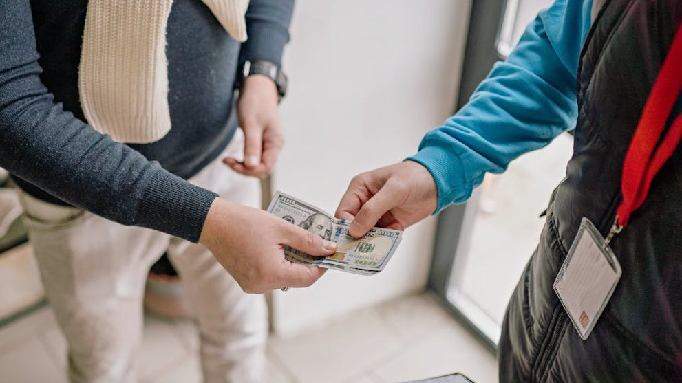 Close up of a Person Paying