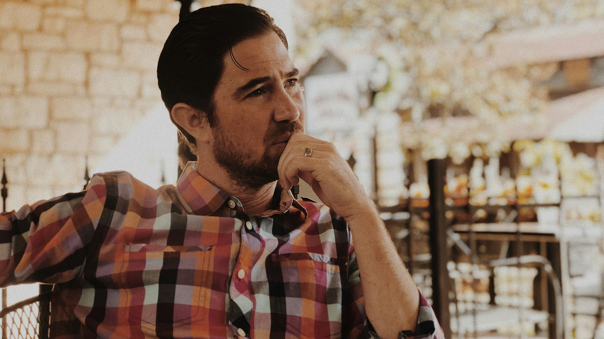 man in red and black plaid dress shirt