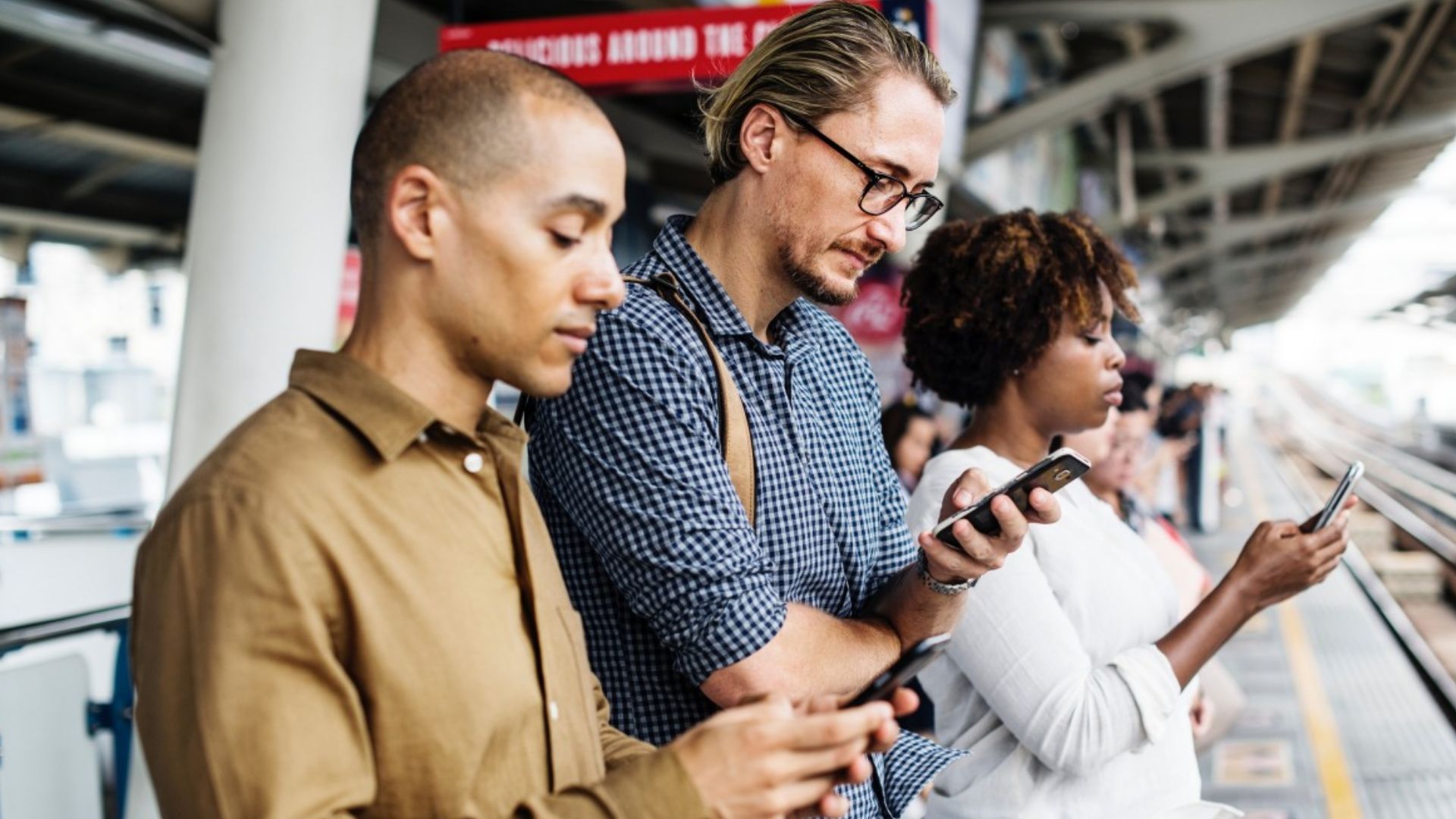 File:Smartphone use at railway station.jpg