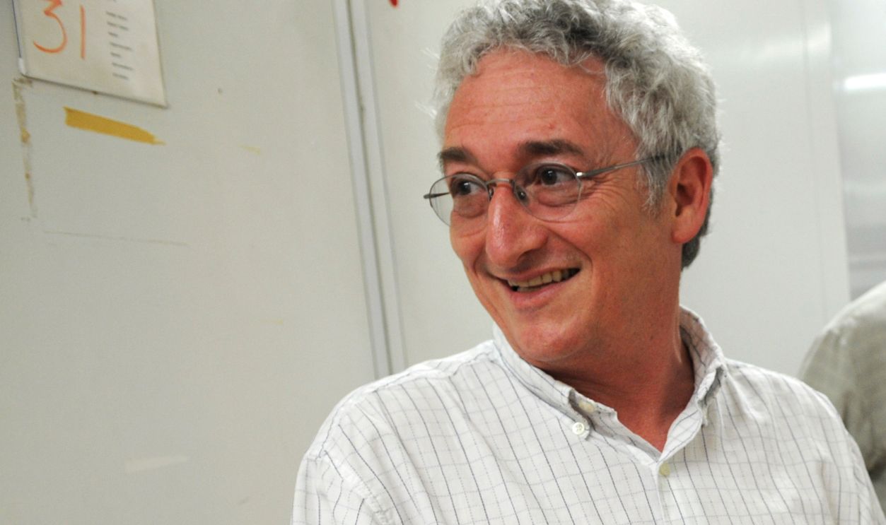 Harry Rubenstein, chair, Division of Politics and Reform, Smithsonian National Museum of American History, shows off an Eisenhower delegate hat which is part of the Smithsonian's political memorabilia collection. William Bird, curator, appears in the background. 