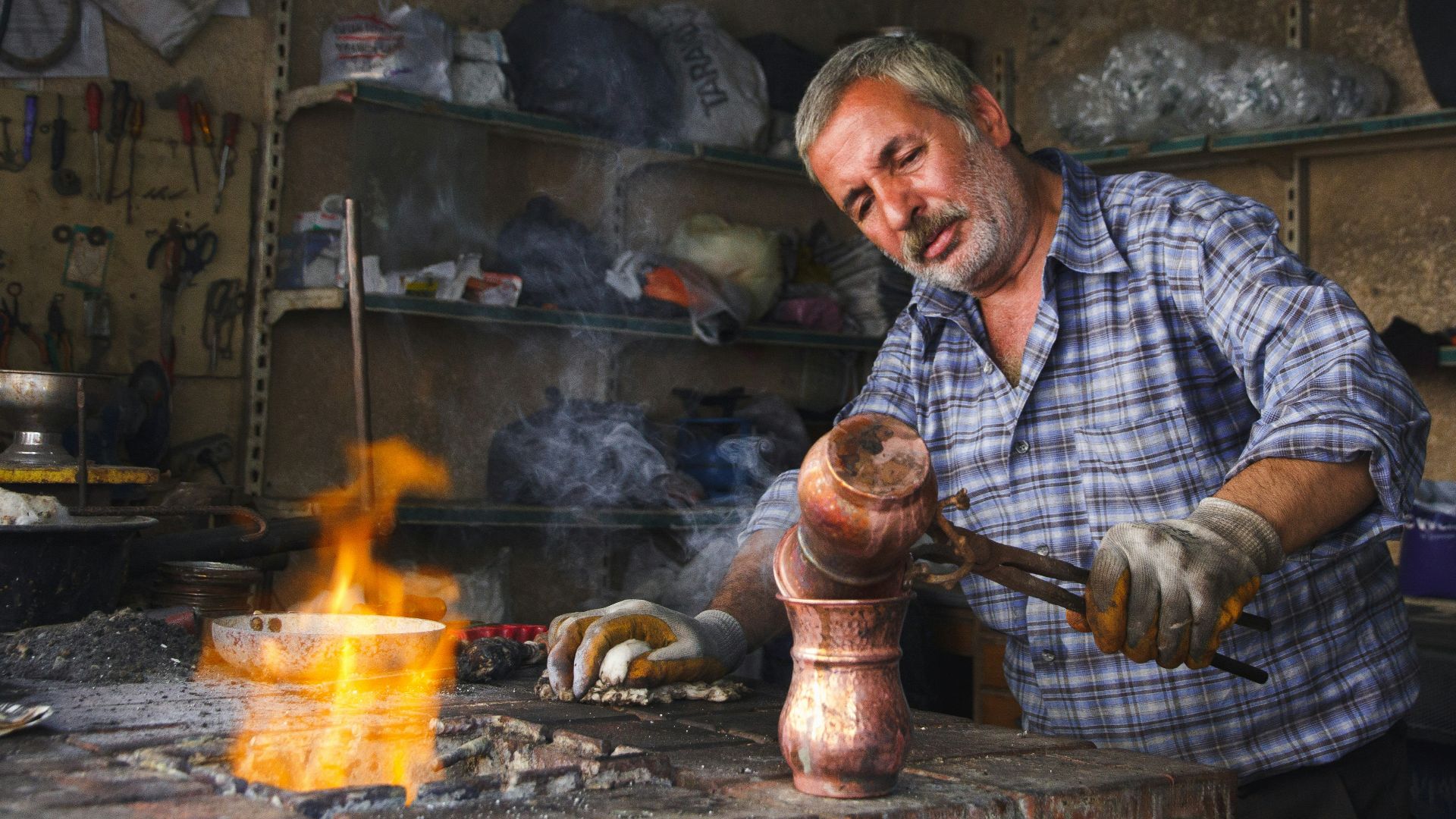 man holding brown hand tool