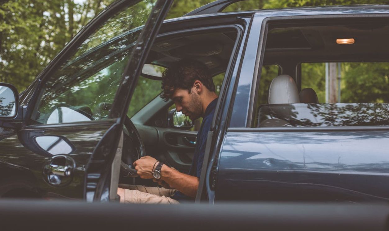man in car