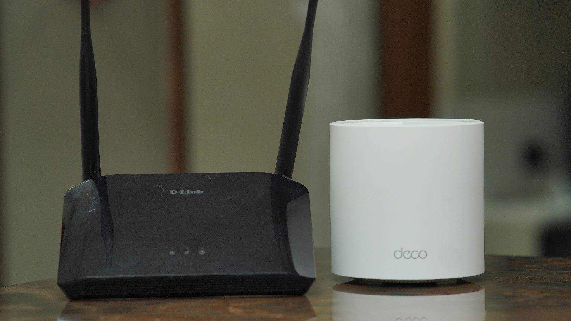 a couple of routers sitting on top of a table