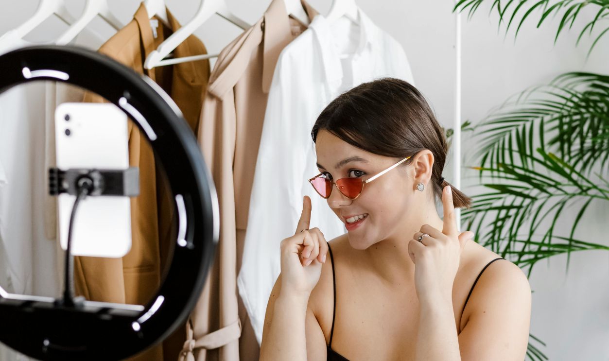 A Woman Showing Her Sunglasses 