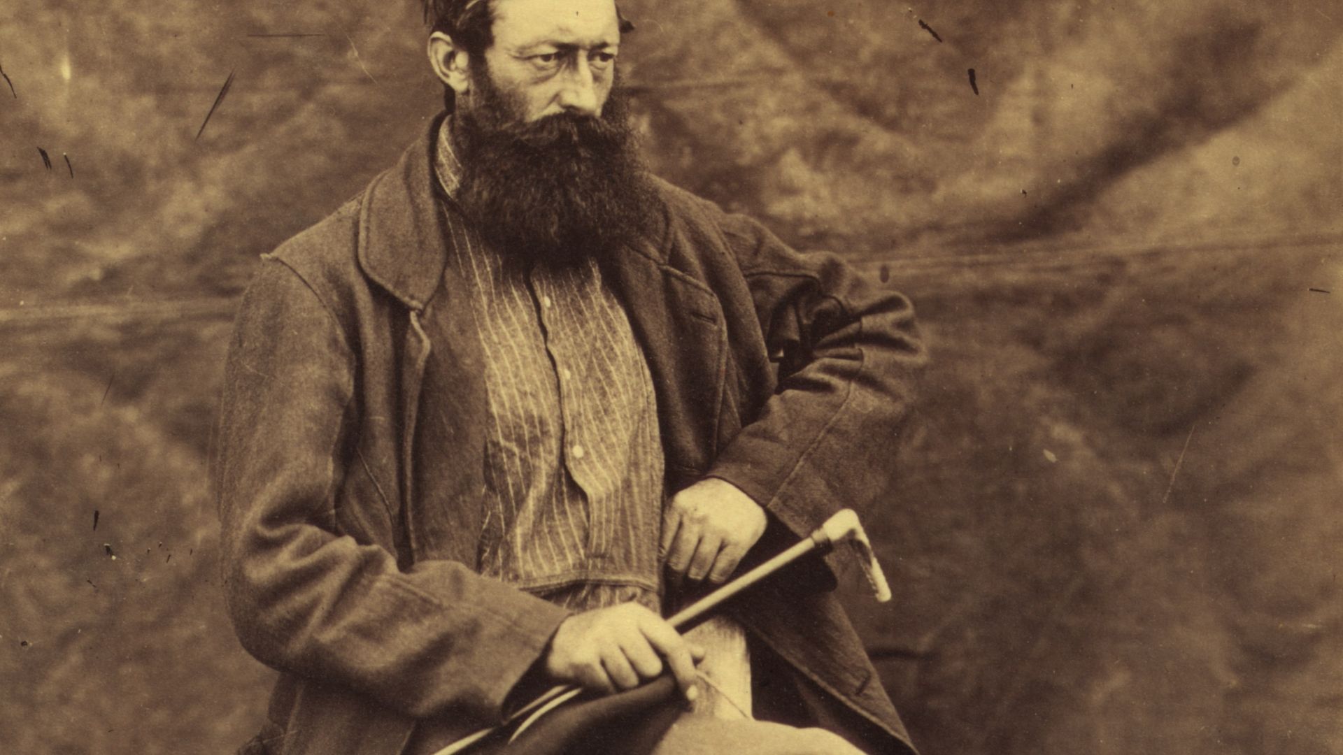 File:Unidentified man, possibly John Keast Lord, naturalist with the Commission survey, full-length portrait, seated, facing right, holding dog whip LCCN2005680431.jpg