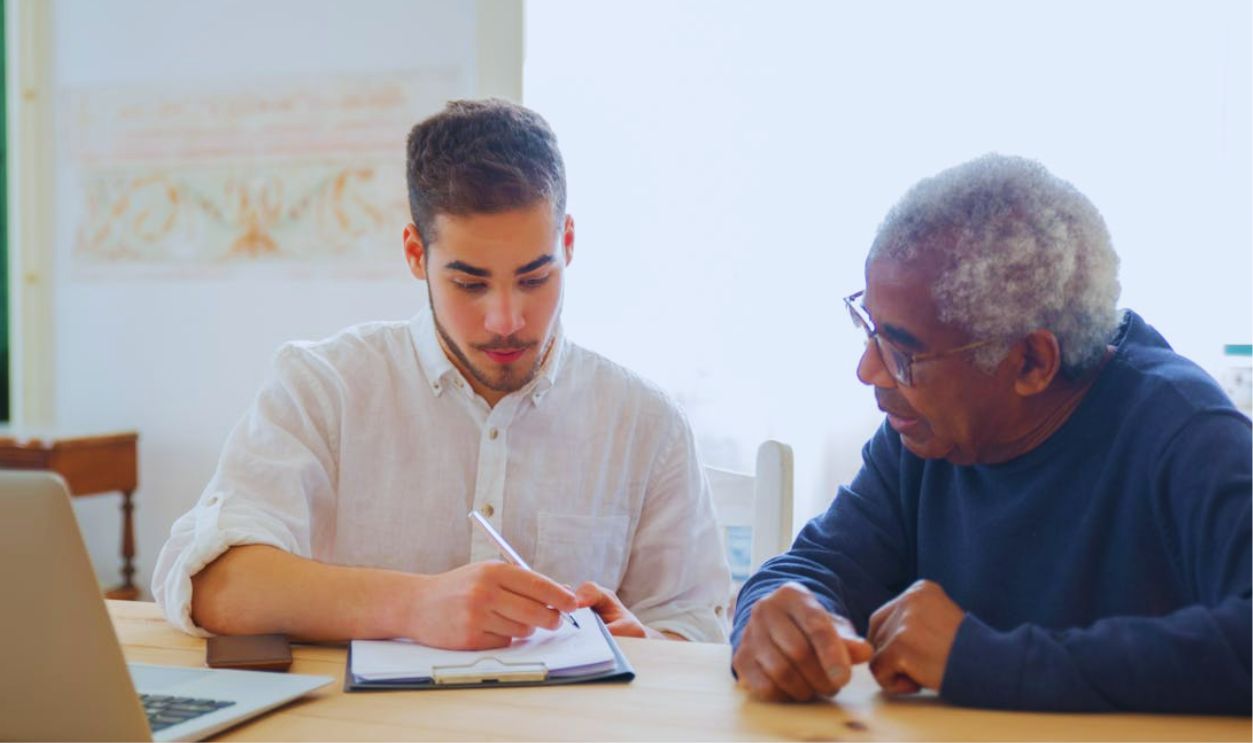 Retired man with social worker