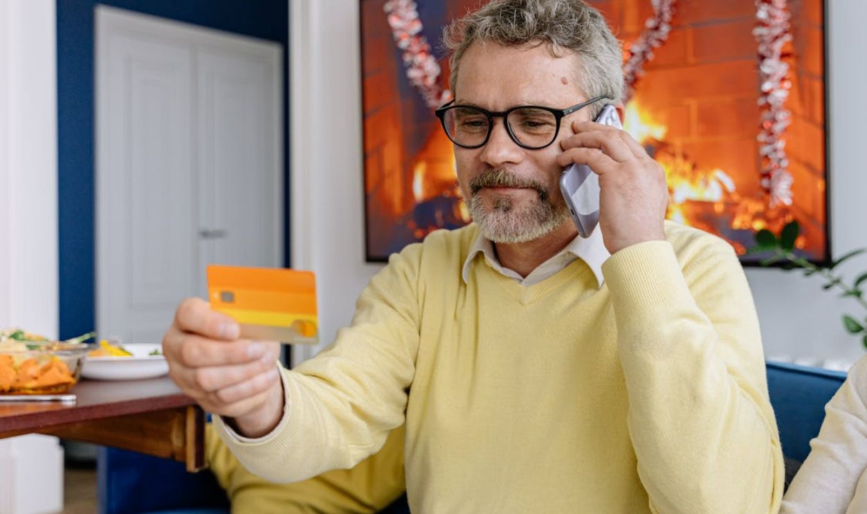 Man on a call with the credit card company
