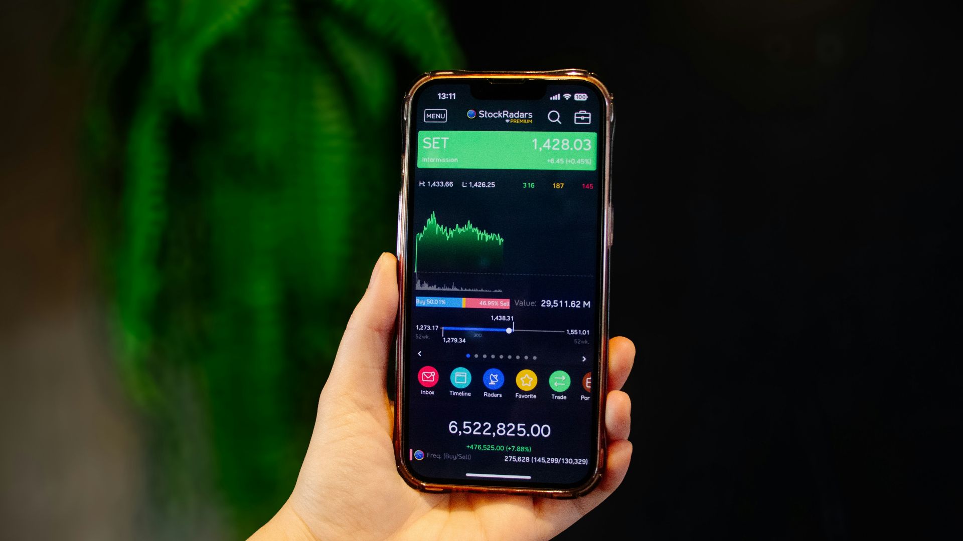 A person holding a smart phone in their hand