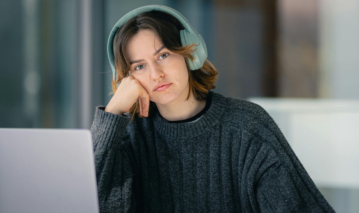 Young Adult Using Laptop look stressed