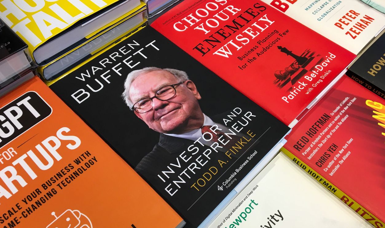 Dubai, UAE - April 21, 2024: Close-up Todd A. Finkle's Warren Buffett: Investor and Entrepreneur book in the bookshop.