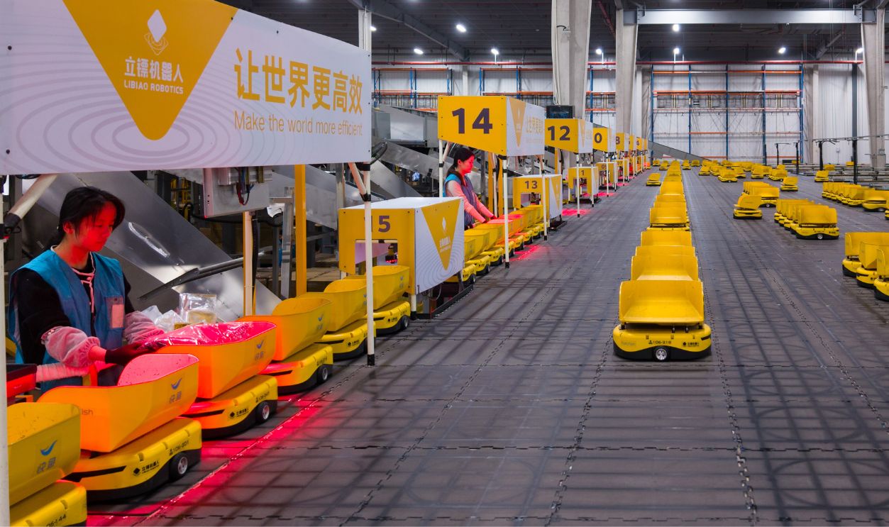 Minions' robots sort express parcels at a logistics center of FastFish Clothing Co., Ltd. ahead of the Double 11 shopping festival on November 10, 2025 in Huzhou, Zhejiang Province of China.