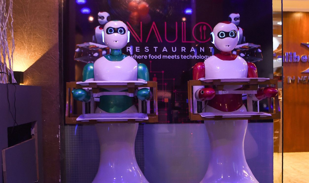 In this picture taken on October 23, 2018, Nepali-made robot waiters are pictured at Naulo restaurant in Kathmandu. - 
