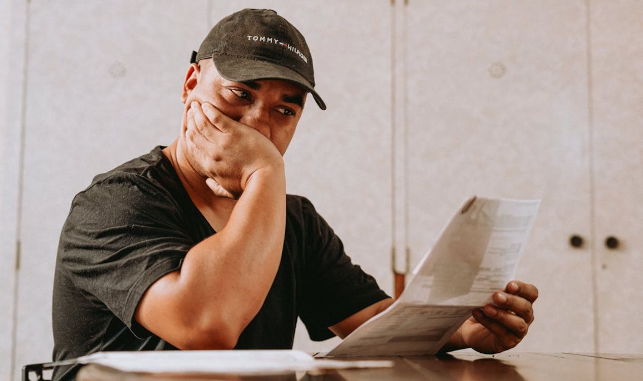 Worried Father Looking on Child School Grades