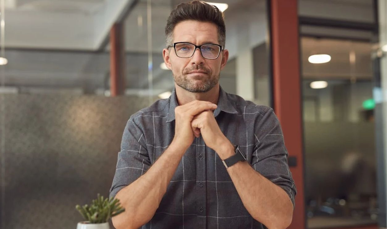 A Man Sitting at the Table