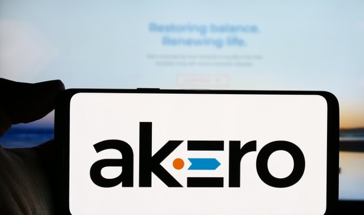 Person holding smartphone with logo of US biotechnology company Akero Therapeutics Inc.