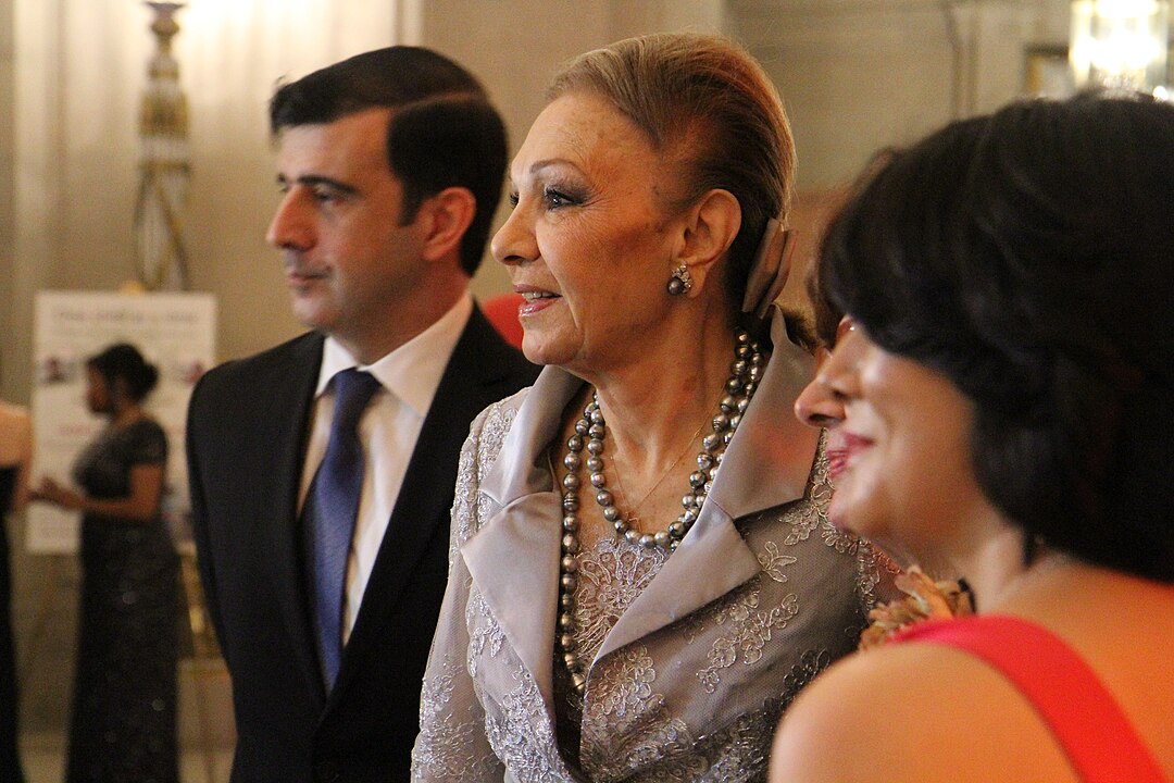 Farah Pahlavi 2016 in silver jacket and jewels