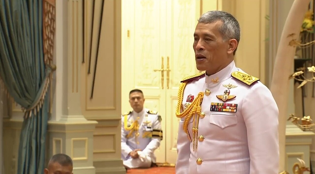 King Vajiralongkorn in white uniform