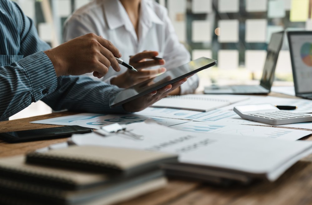 Business adviser meeting to analyze and discuss the situation on the financial report