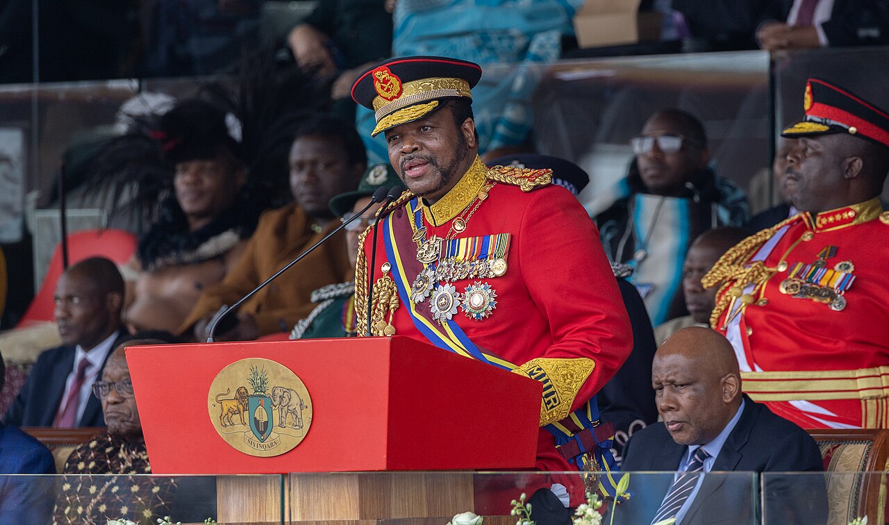 King Mswati III in red uniform