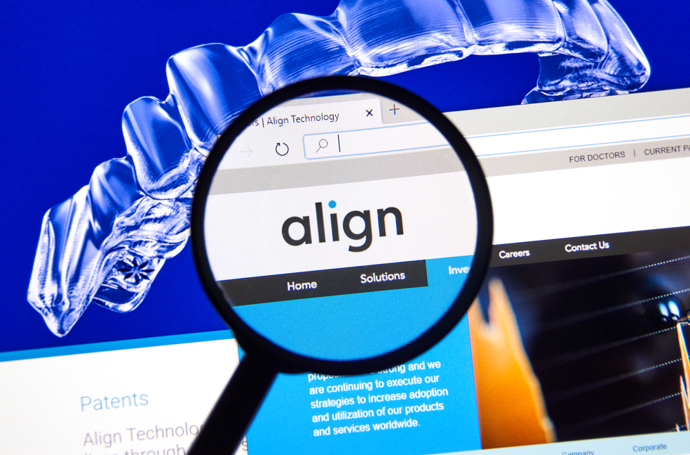 Align Technology official site under magnifying glass.
